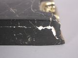 a close up of a black and gold case on a table