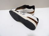 leopard print sneakers with black soles on a white surface