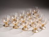 a lot of glasses that are sitting on a table