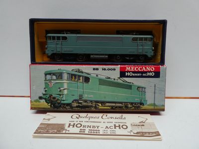 a box with a green train on it and a card in front of it