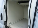 a white van with its door open in a parking lot