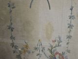 a painting of a bird on the wall next to a vase