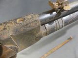 a close up of a gun that is on display