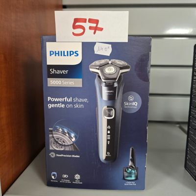une boîte de rasoirs Philips posée sur une étagère dans un magasin