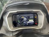 a motorcycle dashboard with a digital display on it