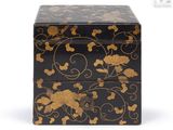 an image of a black and gold box on a white background