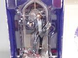 a figurine of a man in a suit and tie in a box