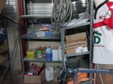 a man that is standing in a garage with a bag