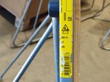 a yellow sticker on the back of a blue chair