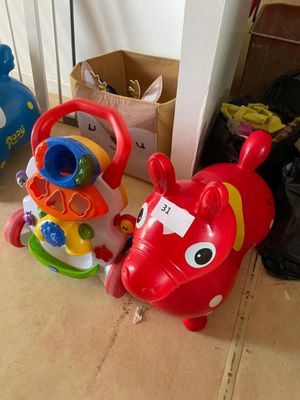 two toys that are sitting on the floor next to each other