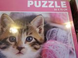 a puzzle box with a picture of a kitten on it