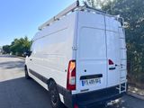 a white van that is parked on the side of the road