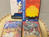 three video games sitting on top of a basket on top of a table