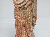 an old statue of a woman holding a baby in her arms