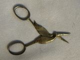 a pair of scissors sitting on top of a table