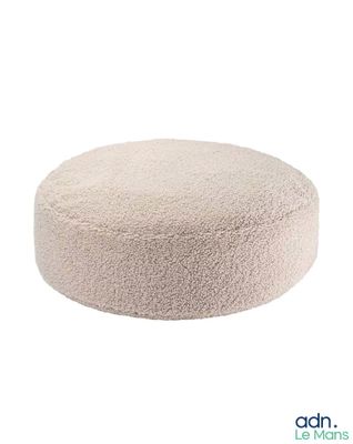 the round dog bed is made from a soft, plush material