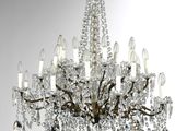 a large crystal chandelier hanging from a ceiling in a room