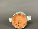 an image of a ceramic ring with a smiley face on it