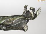 statue of a hand holding a dog on a white background