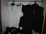 two shirts hanging on a rack in a closet