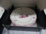 a plate in a box that is open on a table