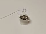 a small piece of jewelry on the table