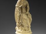 an image of a statue of a woman sitting on top of a pedestal
