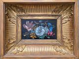 une photo d'un tableau de fleurs dans un cadre doré