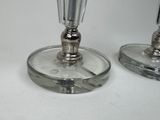 two wine glasses that are sitting on a table