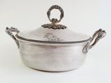 a large silver pot with a handle and a lid