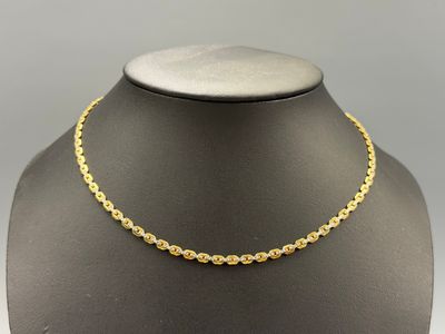 a gold chain necklace on a mannequin mannequin mannequin mannequin mannequin mannequin mannequin mannequin manne