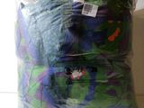 a bag of clothes that is wrapped in plastic