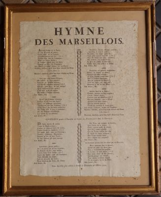 an old book with a gold frame and a list of the names of the people