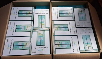 several boxes filled with different types of electronic devices sitting on top of a table