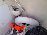 a white toilet and a sink in a small room