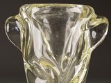 a glass vase that is sitting on a table