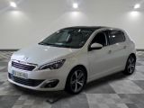the small white car is parked in a large room