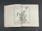 an open book with a map of scotland on it