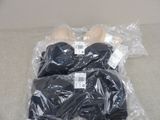 a plastic bag with a pair of bras on it