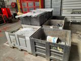 many bins that are stacked up in a warehouse