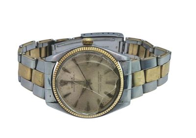 an image of a silver and gold wrist watch on a white background