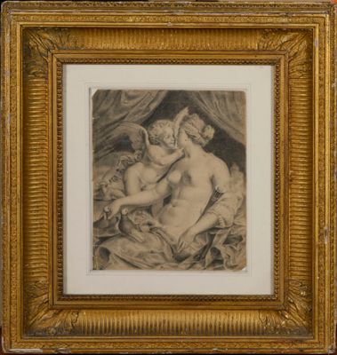 une vieille photo représentant une femme et un enfant, dans un cadre doré