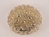a glass ball with a lot of beads on it