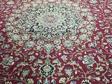 an image of a red carpet with a floral design on it
