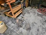an image of a man working on a machine in a garage