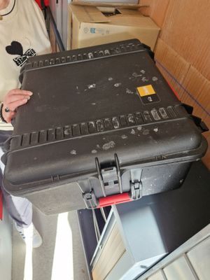 a woman that is holding a suitcase in her hand