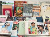 a lot of books that are sitting on a table
