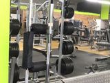 an image of a gym room with a lot of equipment