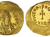 une pièce d'or portant l'image d'un homme