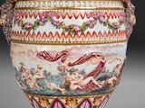a large vase with a painting on the side of it
